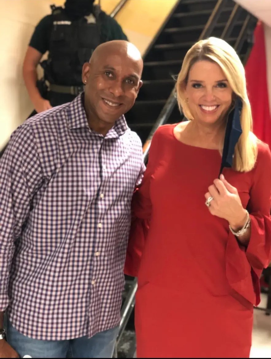 Dr. Dexter King at a community event with Pam Bondy
